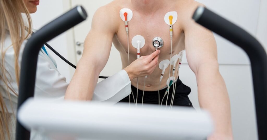 Patient performing stress test with electrocardiographic monitoring.